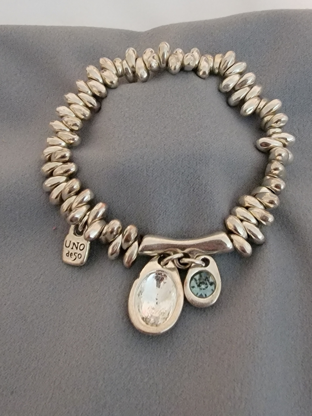 UNO de 50 Stretchy Silver Beaded Bracelet with Light Blue Charm (Stone Missing)